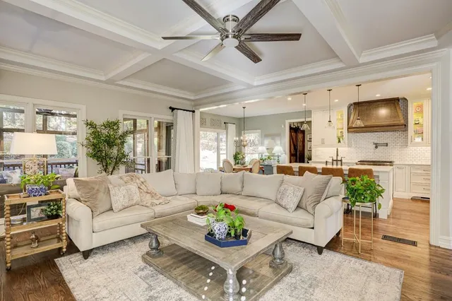 a living room with fireplace furniture and a flat screen tv