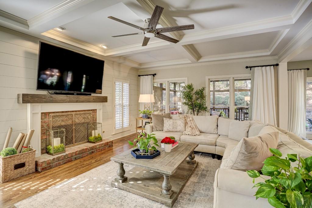 3805 Pennington Road Cumming, GA 30041 - Photo 15 of 63 a living room with furniture a flat screen tv and a fireplace