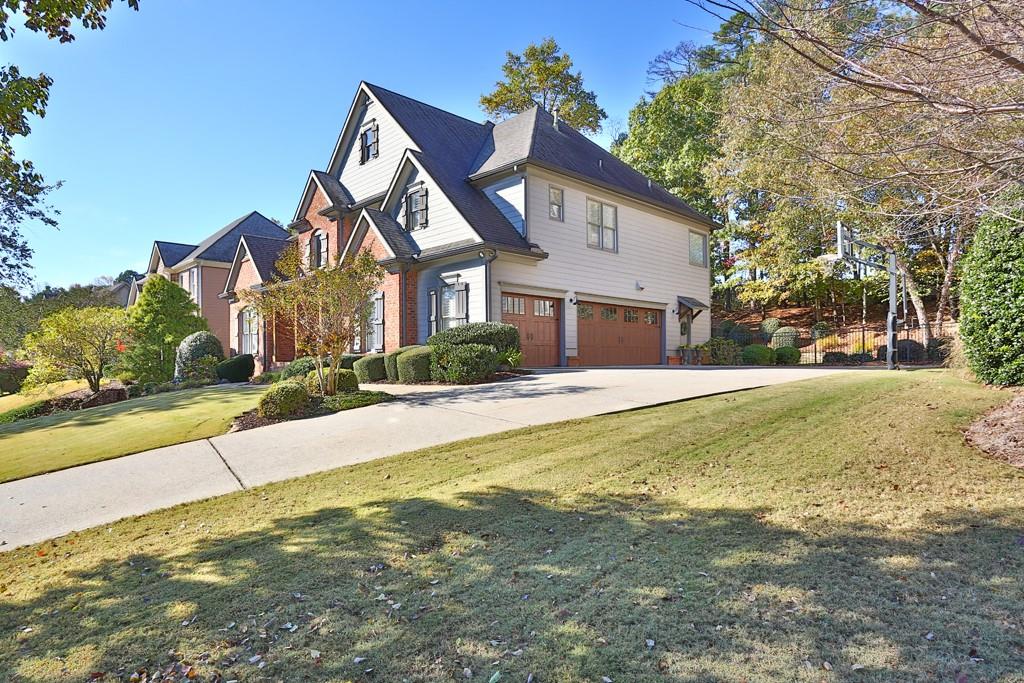 3805 Pennington Road Cumming, GA 30041 - Photo 2 of 63 a front view of house with yard