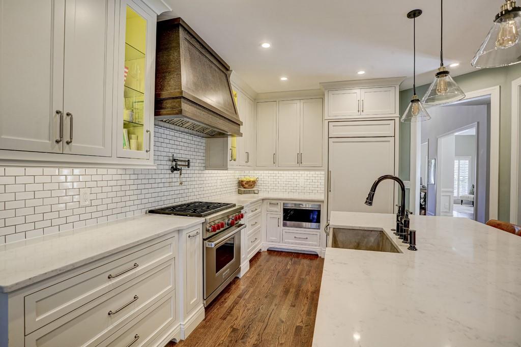 3805 Pennington Road Cumming, GA 30041 - Photo 21 of 63 a kitchen with stainless steel appliances granite countertop a stove a sink and a refrigerator