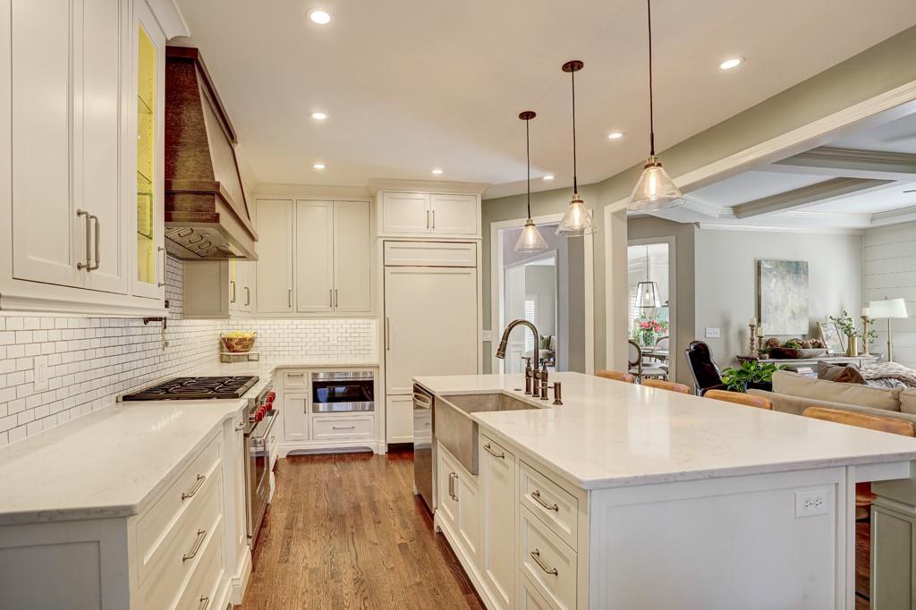 3805 Pennington Road Cumming, GA 30041 - Photo 23 of 63 a kitchen with stainless steel appliances a stove sink and cabinets