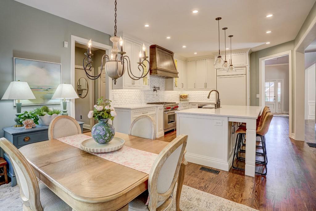 3805 Pennington Road Cumming, GA 30041 - Photo 28 of 63 a kitchen with a table chairs stove and wooden floor