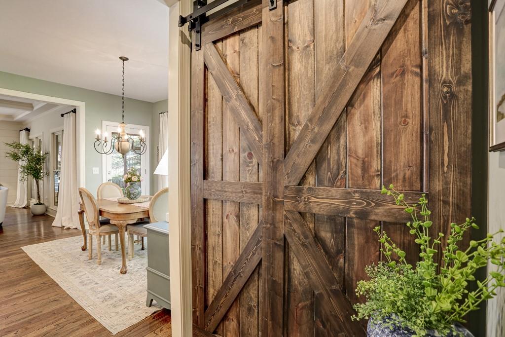 3805 Pennington Road Cumming, GA 30041 - Photo 31 of 63 a view of a hallway with wooden floor and stairs
