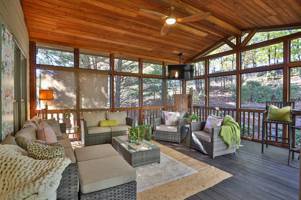 3805 Pennington Road Cumming, GA 30041 - Photo 32 of 63 a living room with furniture and a large window with garden view
