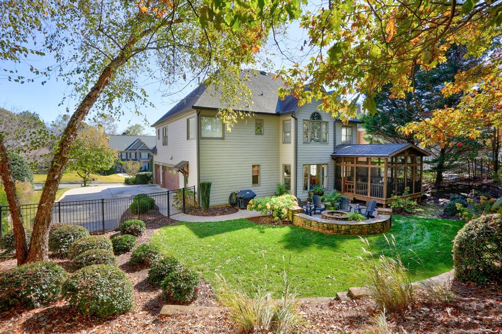 3805 Pennington Road Cumming, GA 30041 - Photo 37 of 63 a front view of a house with garden and sitting area