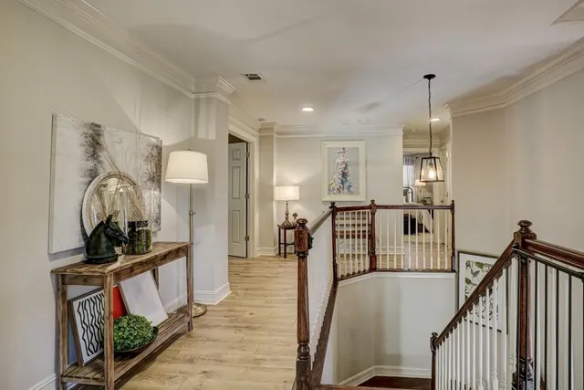 a spacious bathroom with a double vanity sink toilet and a mirror