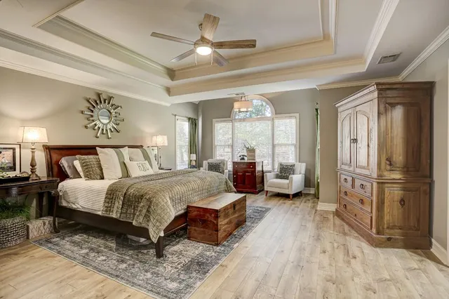 a view of a hallway with wooden floor and entryway