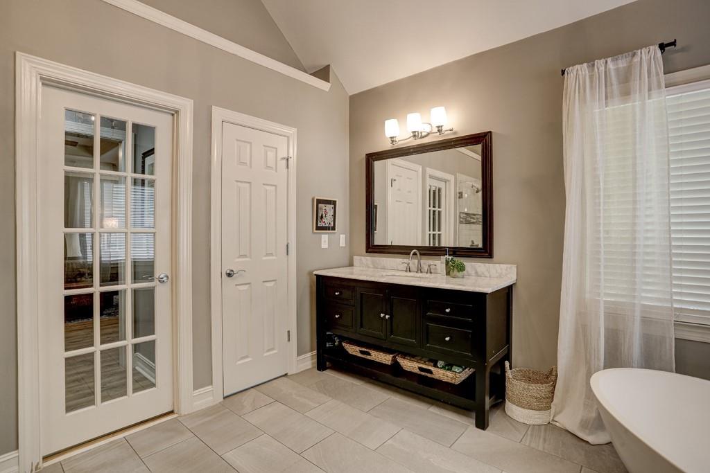 3805 Pennington Road Cumming, GA 30041 - Photo 50 of 63 a bathroom with a sink a toilet and a mirror
