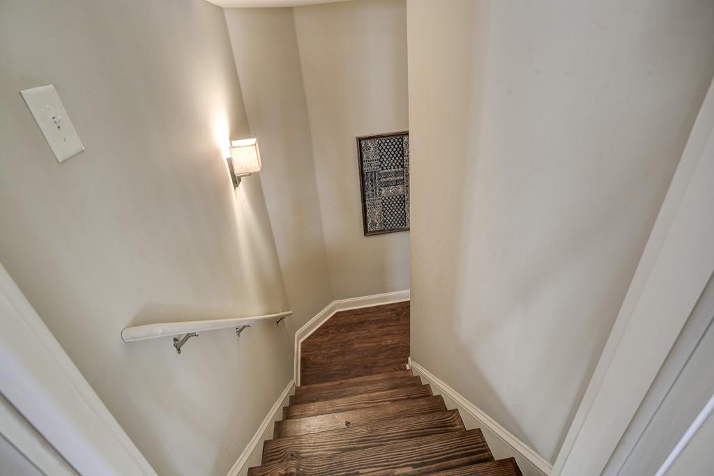 3805 Pennington Road Cumming, GA 30041 - Photo 56 of 63 a view of a hallway with wooden floor and entryway