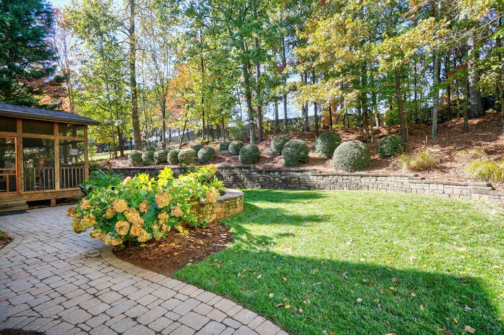 3805 Pennington Road Cumming, GA 30041 - Photo 61 of 63 a front view of a house with garden