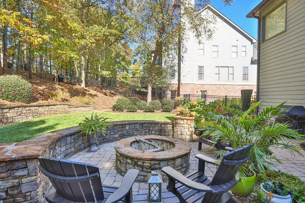 3805 Pennington Road Cumming, GA 30041 - Photo 63 of 63 a backyard of a house with table and chairs