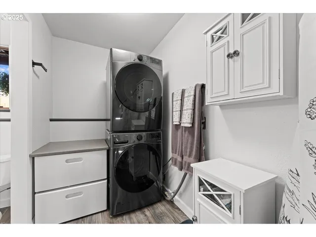 a kitchen with cabinets and a refrigerator