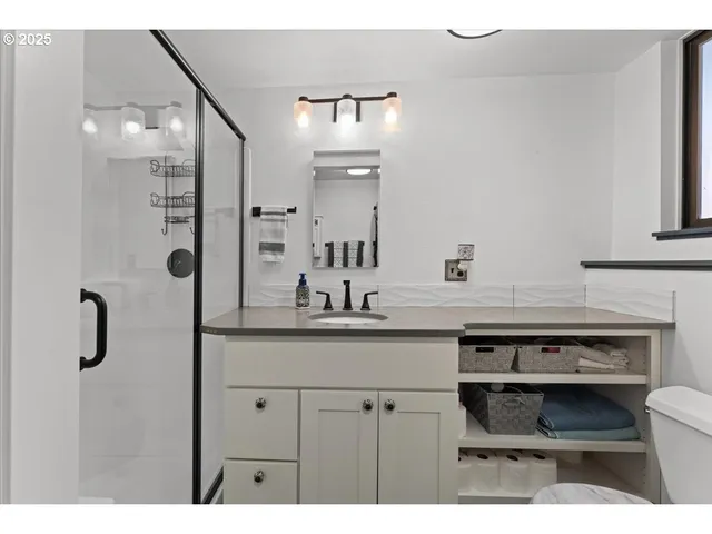 a kitchen with a sink and a refrigerator