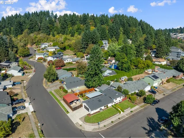 an aerial view of a house with a garden