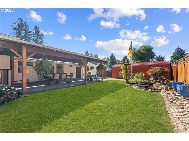 a view of an house with backyard space and dining space