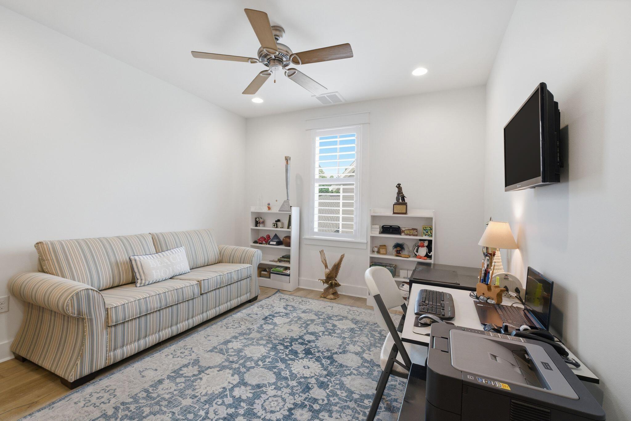 133 Sandchase Circle, Unit LOT 15 Inlet Beach, FL 32461 - Photo 28 of 47 a living room with furniture and a flat screen tv