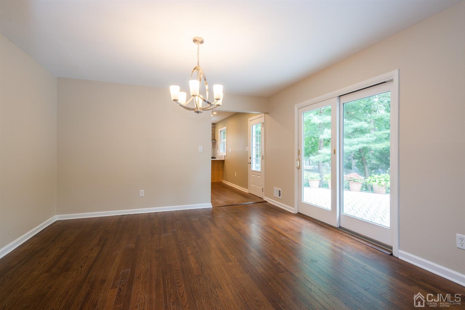 20 Donald Road East Brunswick, NJ 08816 - Photo 11 of 28 a view of wooden floor and windows in a room