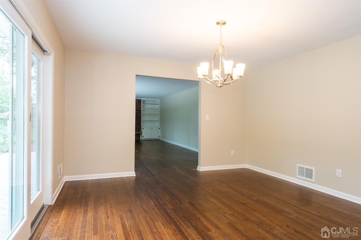 20 Donald Road East Brunswick, NJ 08816 - Photo 12 of 28 a view of a room with wooden floor and chandelier