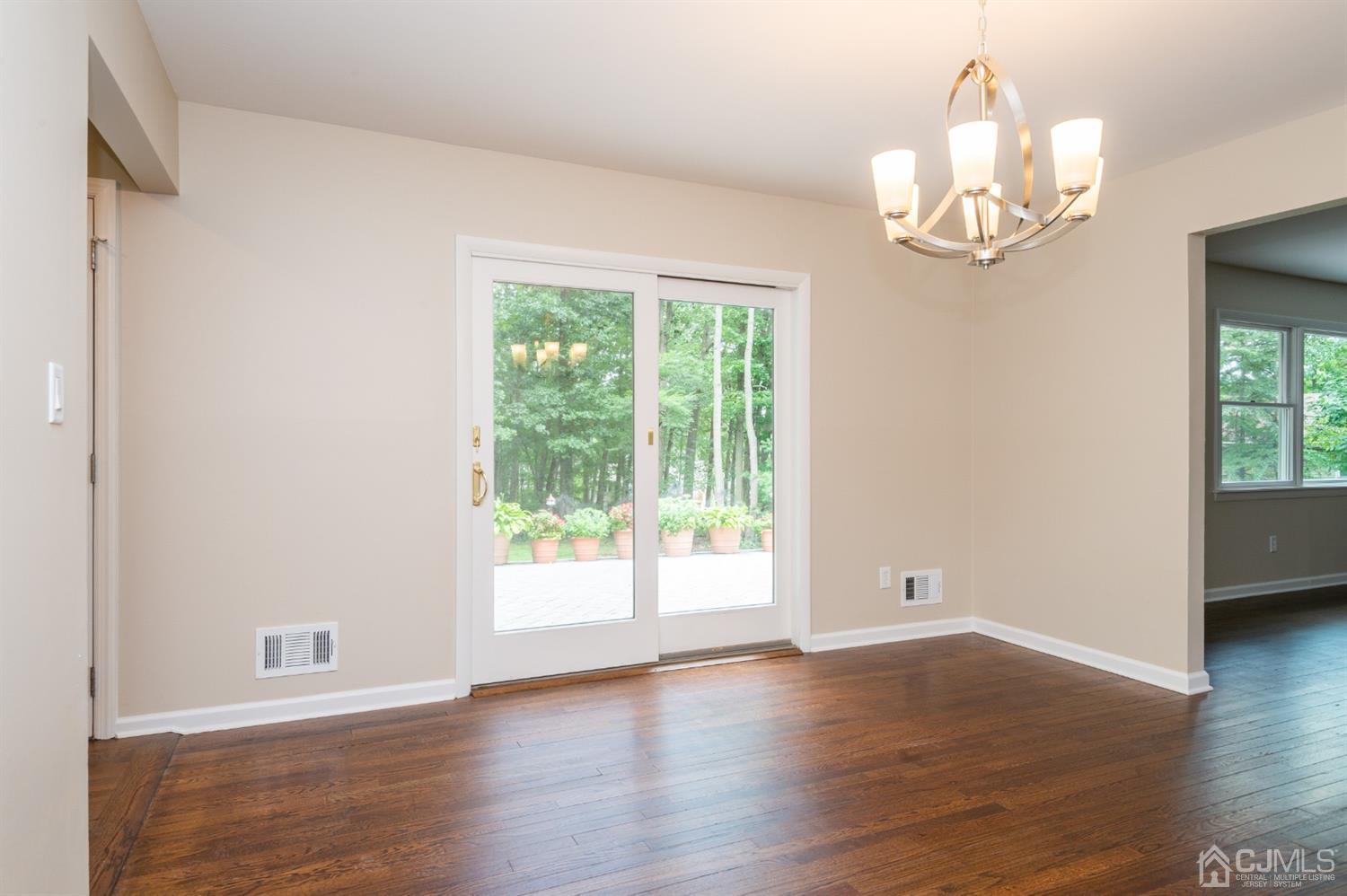 20 Donald Road East Brunswick, NJ 08816 - Photo 13 of 28 a view of an empty room with wooden floor and a window