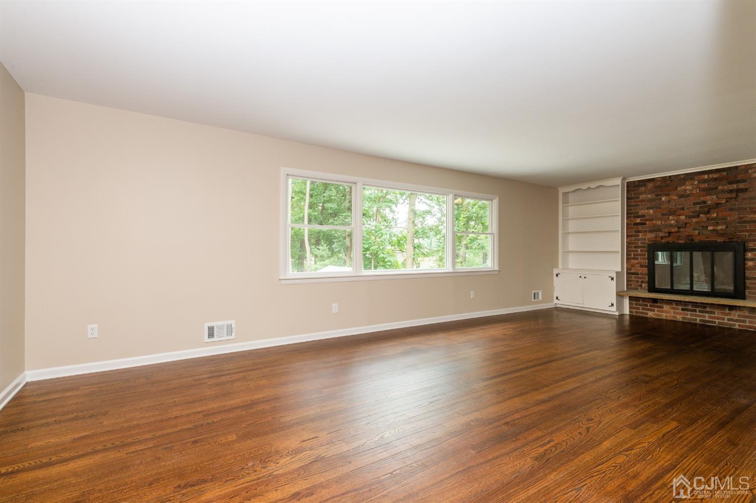 20 Donald Road East Brunswick, NJ 08816 - Photo 14 of 28 an empty room with wooden floor and windows