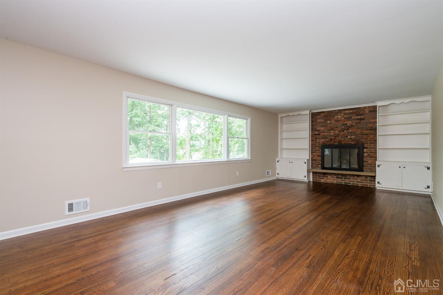 20 Donald Road East Brunswick, NJ 08816 - Photo 15 of 28 wooden floor in an empty room with a window