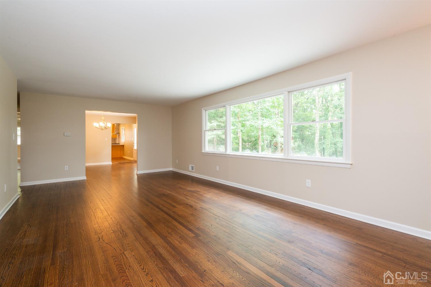 20 Donald Road East Brunswick, NJ 08816 - Photo 16 of 28 an empty room with wooden floor and windows