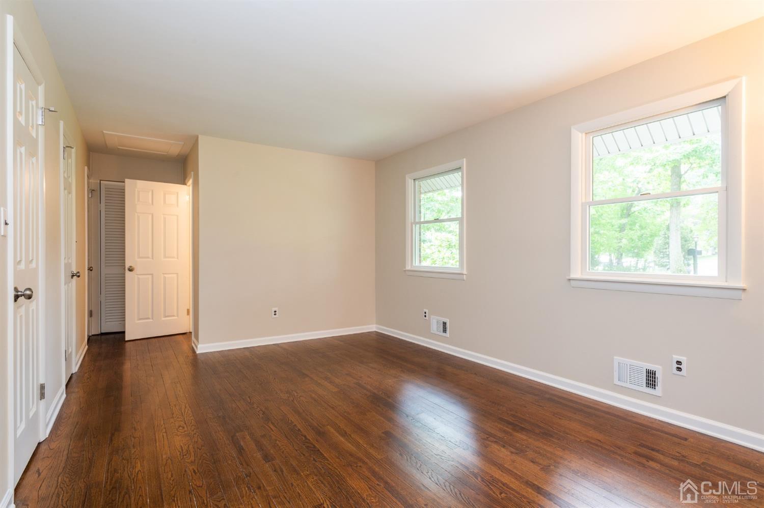 20 Donald Road East Brunswick, NJ 08816 - Photo 17 of 28 a view of an empty room with wooden floor and a window