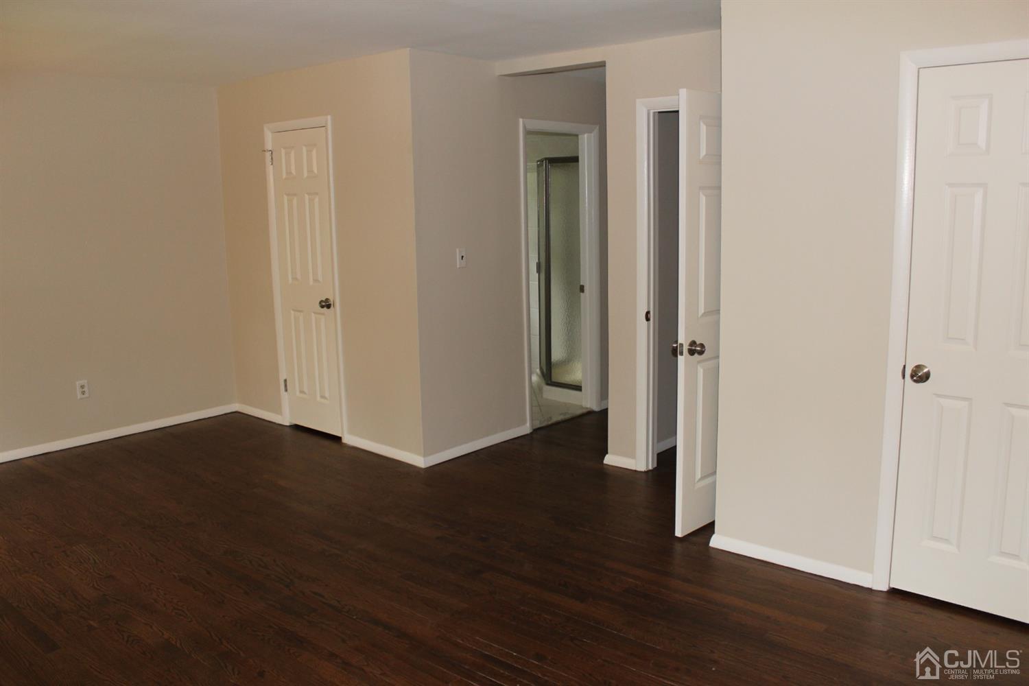 20 Donald Road East Brunswick, NJ 08816 - Photo 19 of 28 a view of an empty room with wooden floor and closet