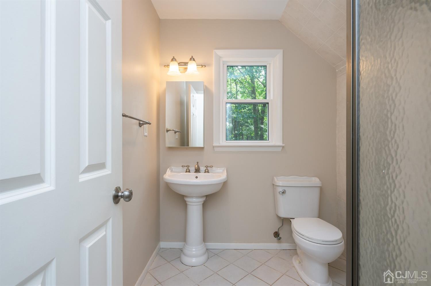 20 Donald Road East Brunswick, NJ 08816 - Photo 20 of 28 a bathroom with a toilet sink and mirror