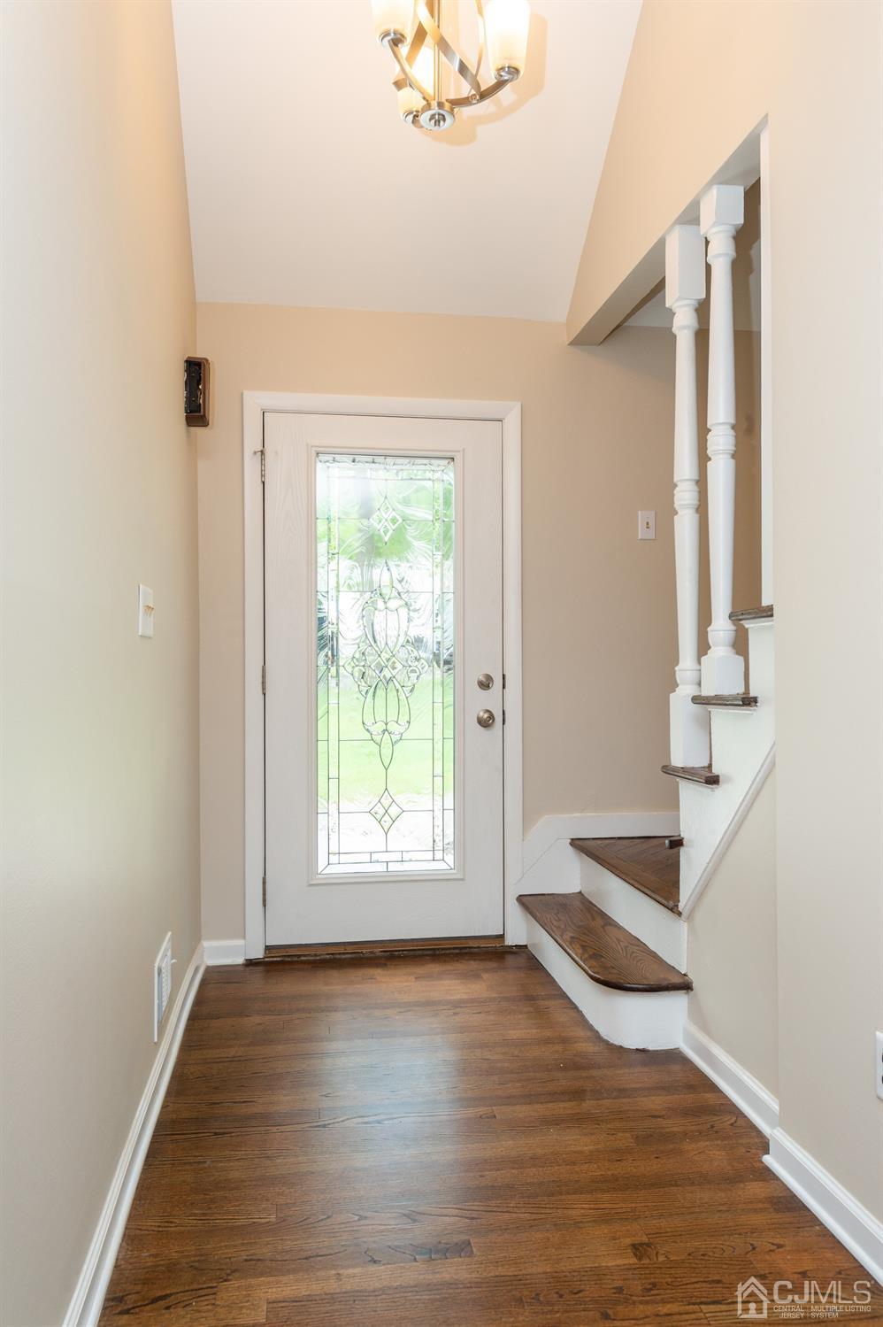 20 Donald Road East Brunswick, NJ 08816 - Photo 3 of 28 an empty room with wooden floor and windows