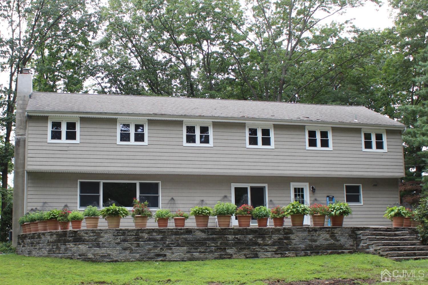 20 Donald Road East Brunswick, NJ 08816 - Photo 25 of 28 a front view of a house with garden