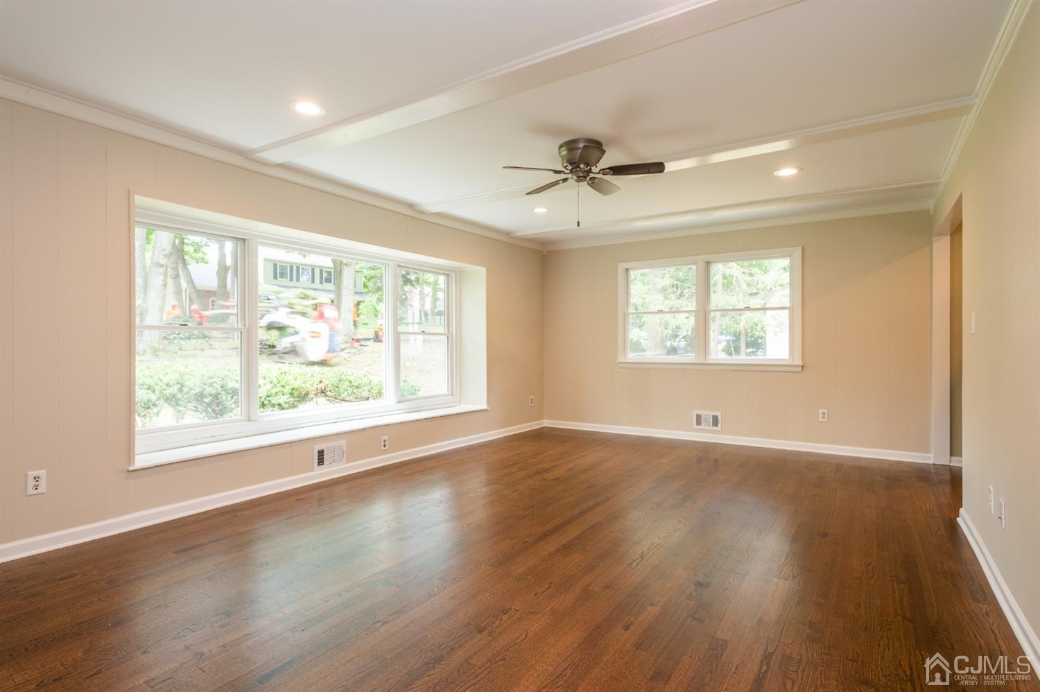 20 Donald Road East Brunswick, NJ 08816 - Photo 5 of 28 a view of an empty room with a window and wooden floor