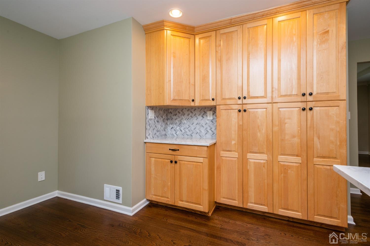 20 Donald Road East Brunswick, NJ 08816 - Photo 6 of 28 a view of a cabinet with wooden floor