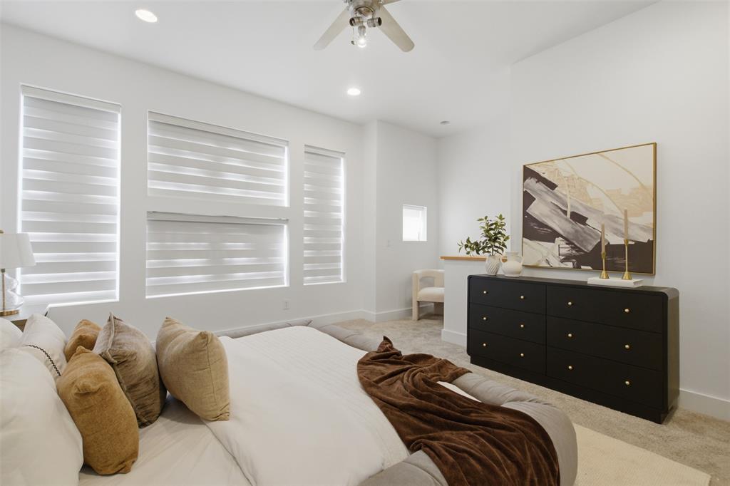 2111 Clark Street, Unit H Dallas, TX 75204 - Photo 23 of 37 a bedroom with a bed and window