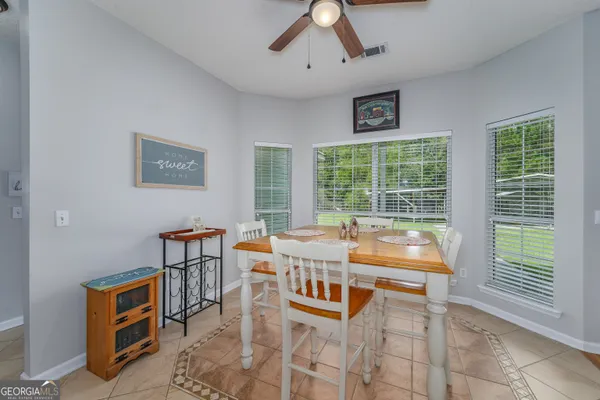 a kitchen with granite countertop a sink and a window