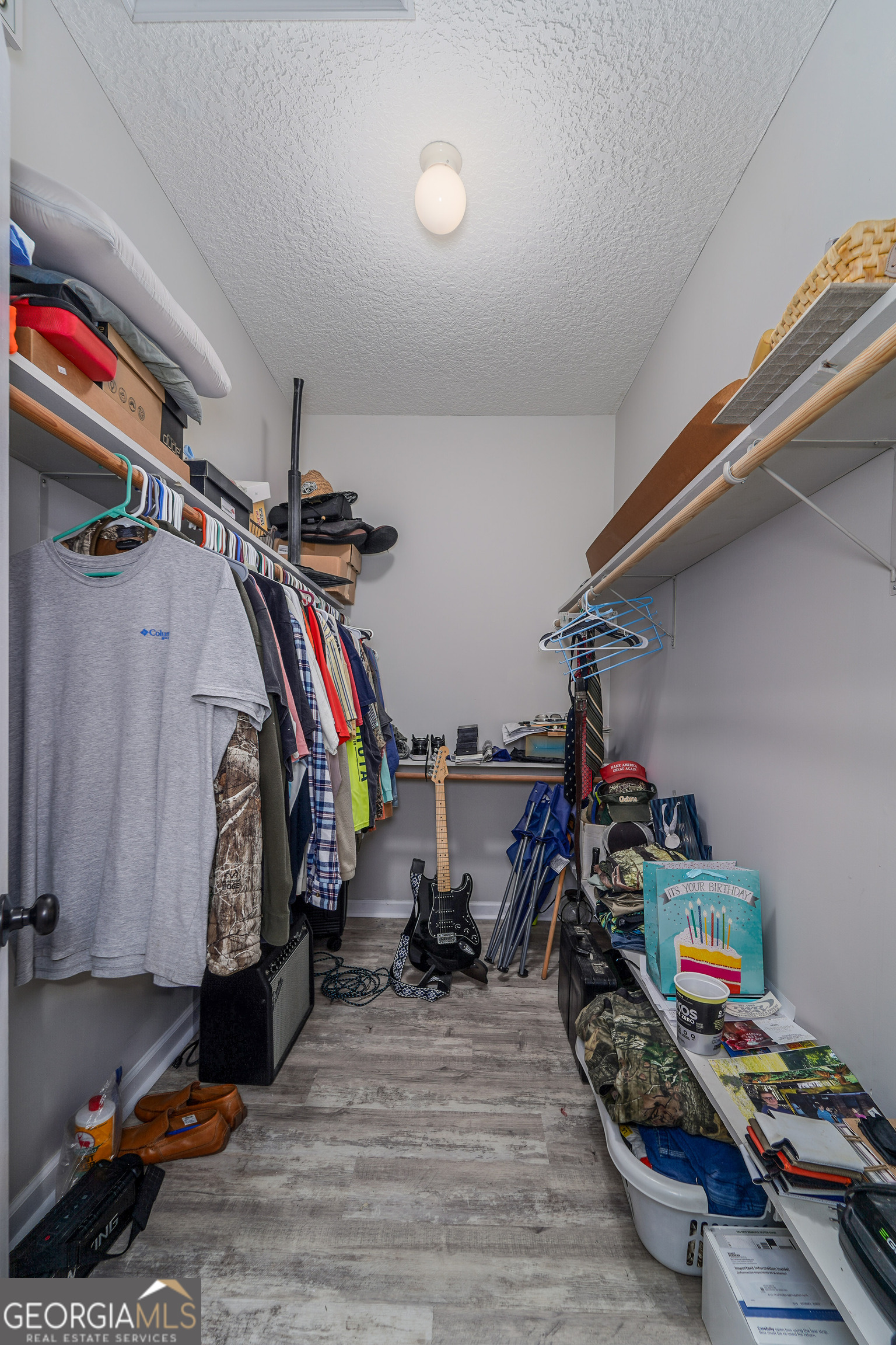 400 Smith Road Waycross, GA 31503 - Photo 19 of 25 a view of walk in closet with clothes and shoes
