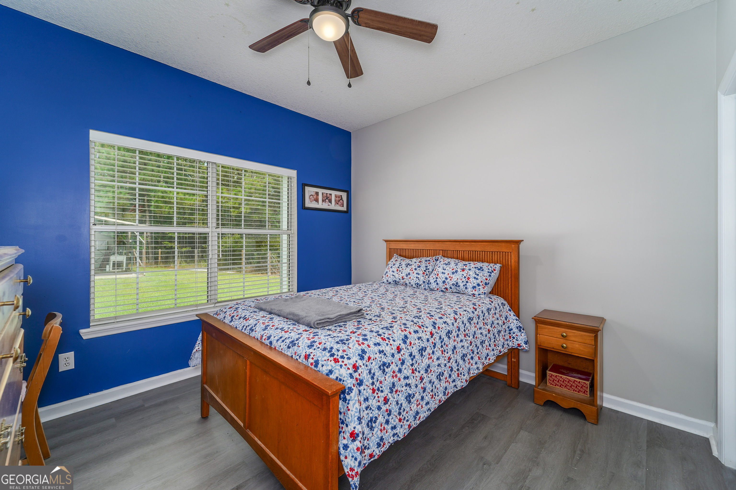 400 Smith Road Waycross, GA 31503 - Photo 25 of 25 a bed sitting in a bedroom next to a window