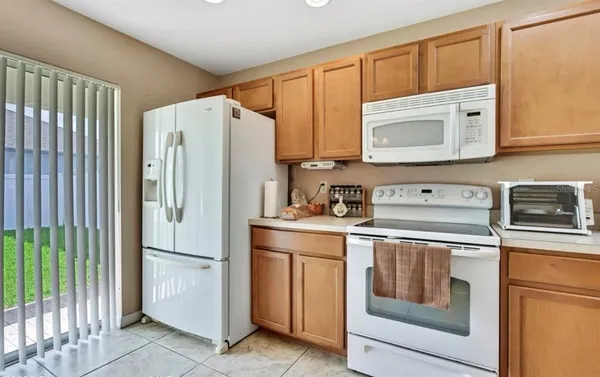 a kitchen with a stove microwave and refrigerator