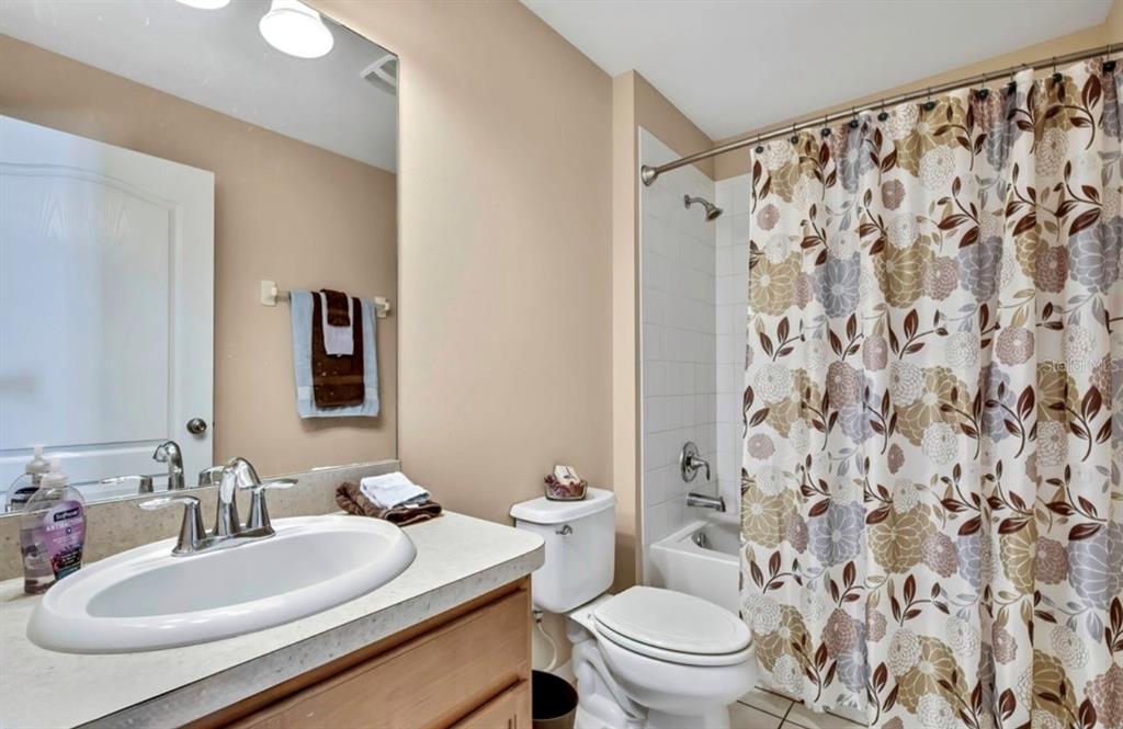 209 Winthrop Drive Spring Hill, FL 34609 - Photo 16 of 27 a bathroom with a sink and a mirror