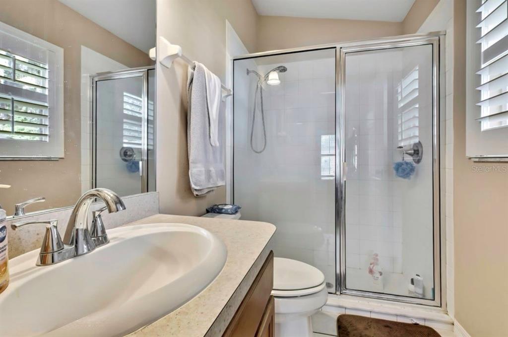 209 Winthrop Drive Spring Hill, FL 34609 - Photo 20 of 27 a bathroom with a sink toilet and shower