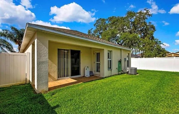 a view of a house with backyard porch and garden