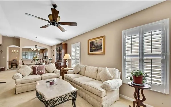 a living room with furniture and a window