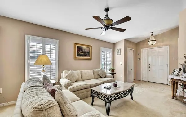 a living room with furniture and a rug