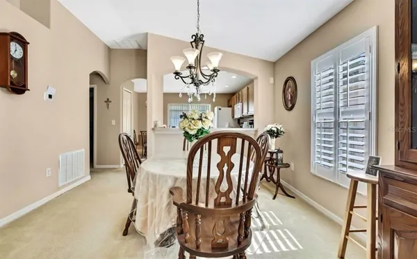 a view of a dining room with furniture window and outside view
