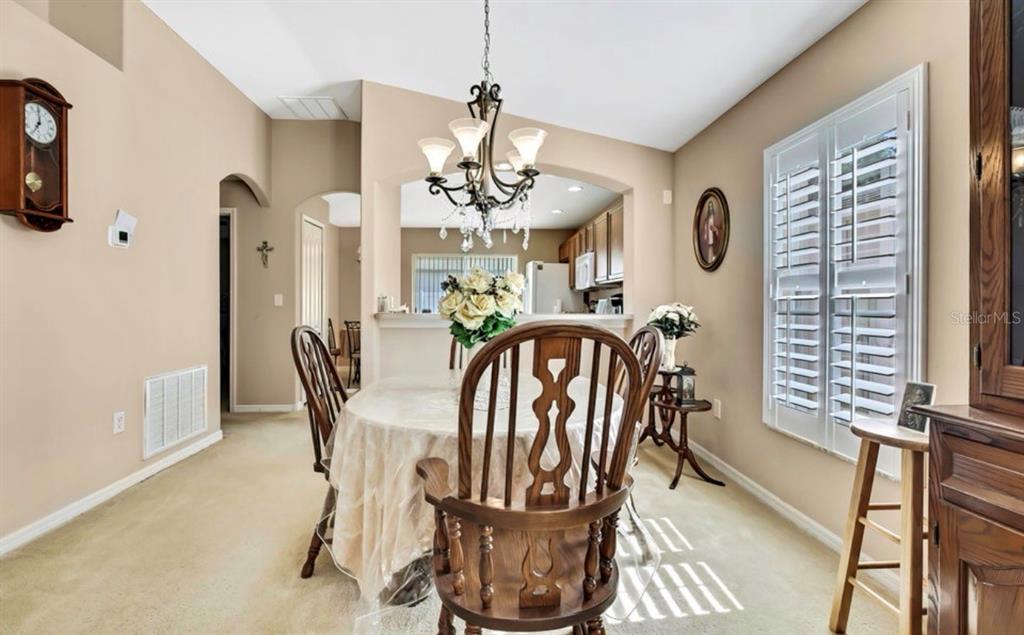 209 Winthrop Drive Spring Hill, FL 34609 - Photo 8 of 27 a view of a dining room with furniture window and outside view