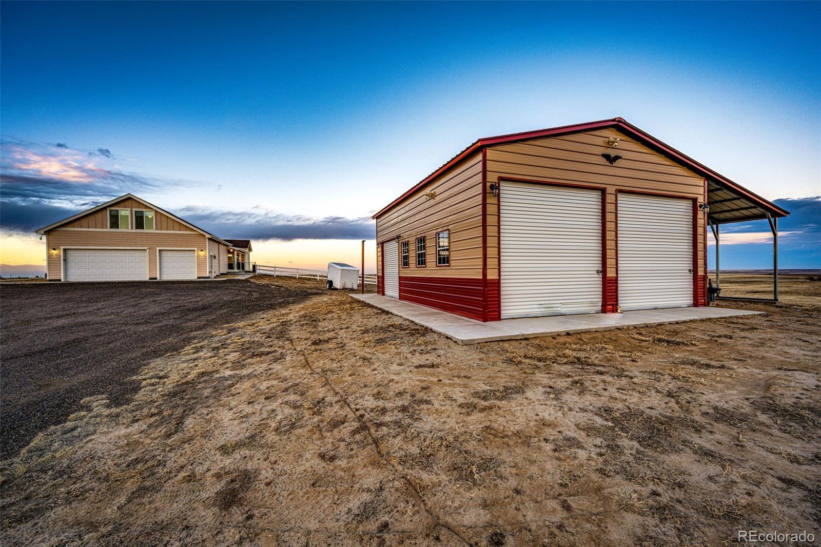 4820 Kiowa-Bennett Road Bennett, CO 80102 - Photo 2 of 29 a front view of a house with a yard