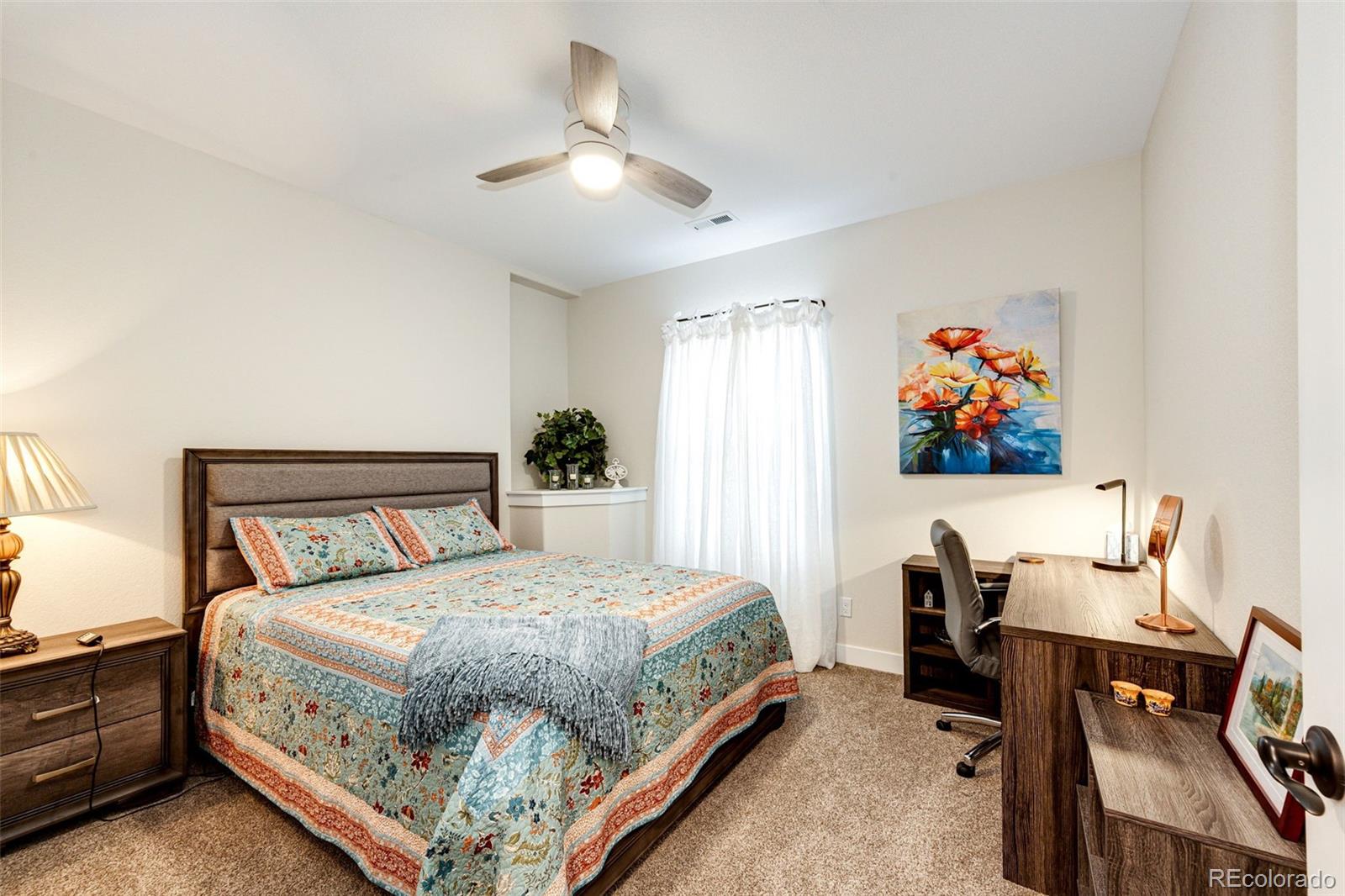 4820 Kiowa-Bennett Road Bennett, CO 80102 - Photo 22 of 29 a bedroom with a bed and a chandelier