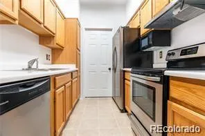 a view of an empty room with a fireplace