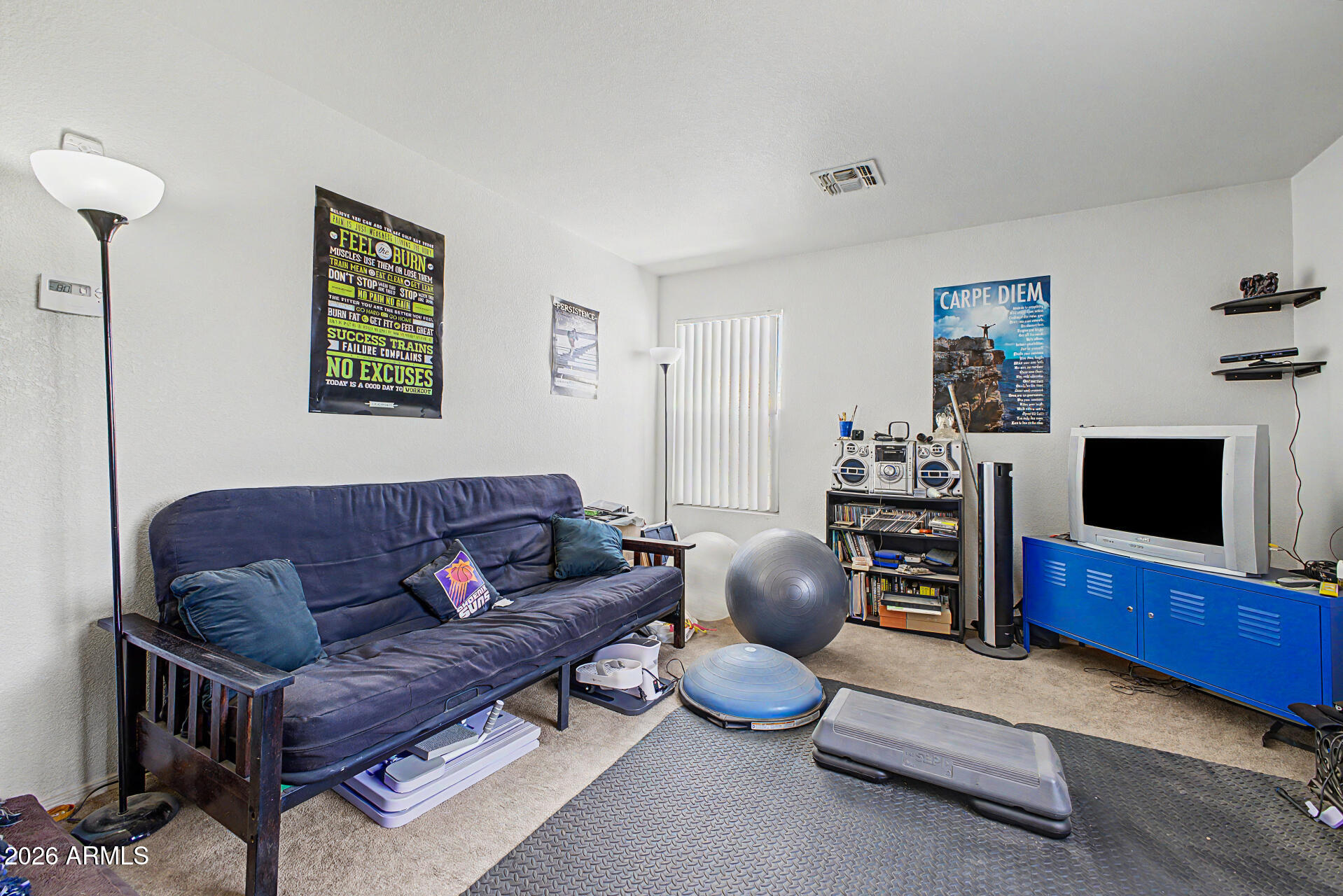 2607 West Bloch Road Phoenix, AZ 85041 - Photo 28 of 34 a living room with furniture and a flat screen tv