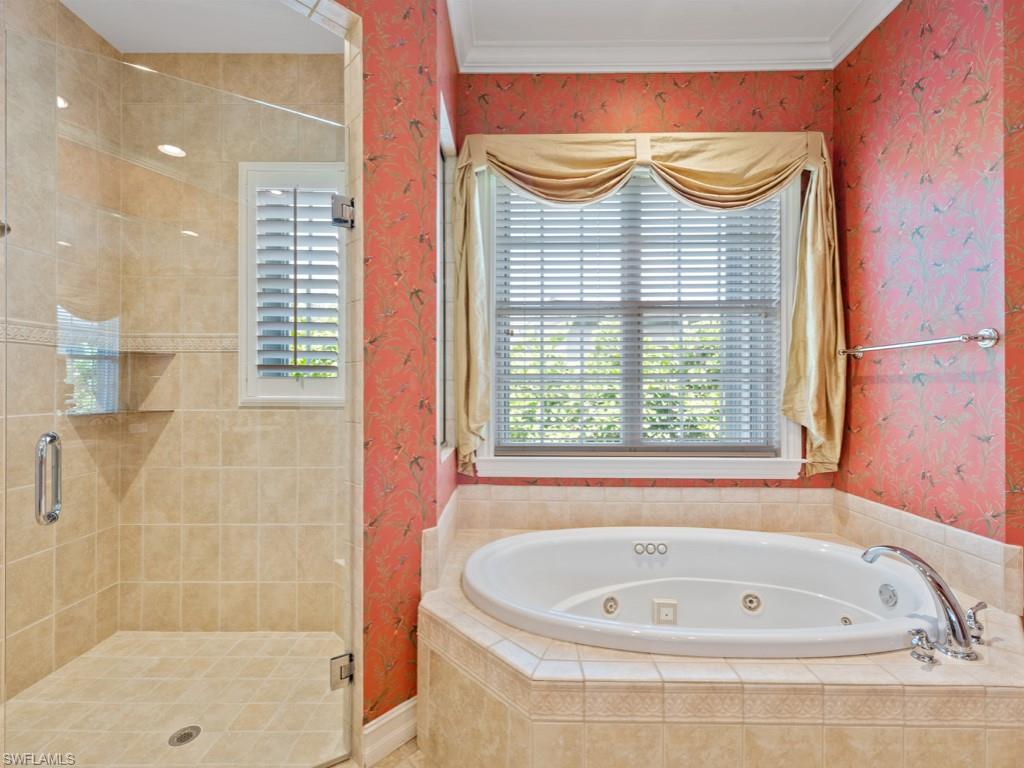 505 Harbour Drive Naples, FL 34103 - Photo 12 of 37 a bathroom with a bathtub and shower